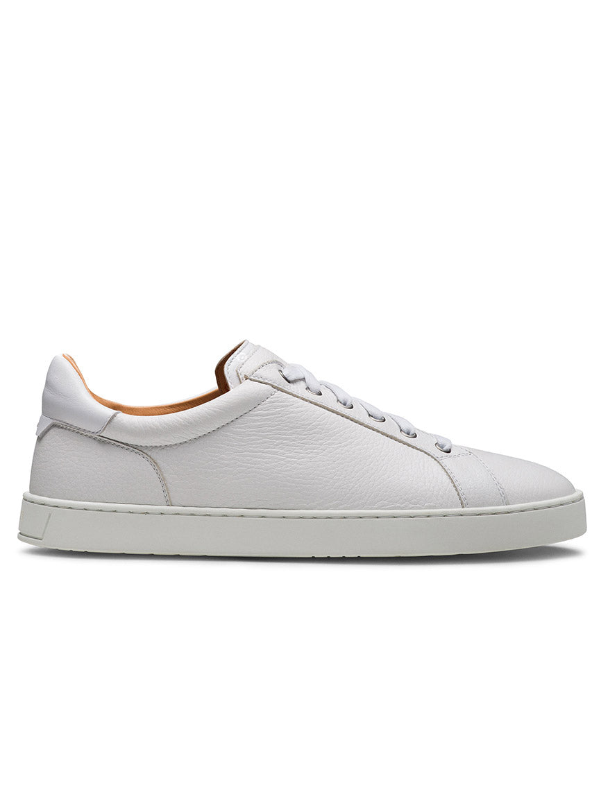 The Magnanni Cote Lo Stretch-Lace in Tumbled White/White is a men's white low-top sneaker with a flat sole, stretch-lace system, and minimal detailing, shown in a side view.