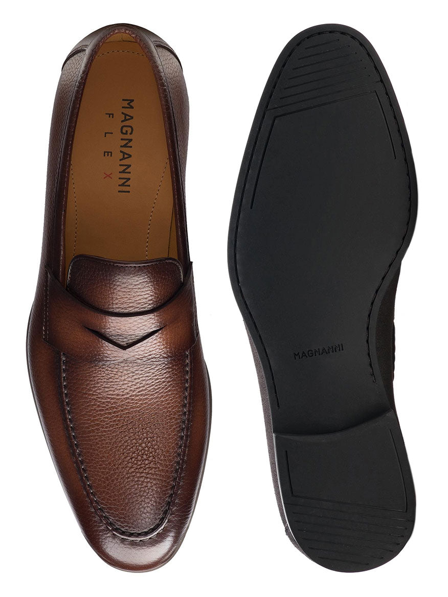 A pair of Magnanni Diezma II in Brown penny loafers made of calfskin leather on a white background.