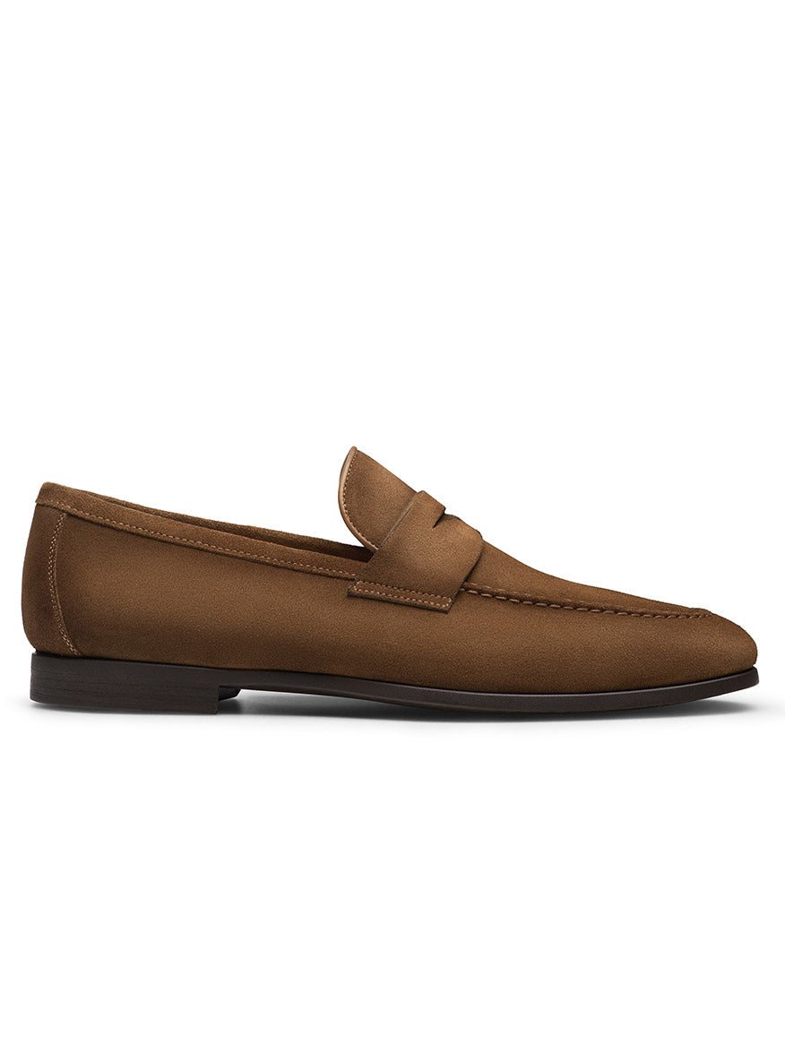The Magnanni Diezma in Taupe Suede is a classic loafer featuring premium taupe suede, a low heel, rounded toe, and the signature penny slot detail. Handmade in Portugal, it is shown in profile against a white background.