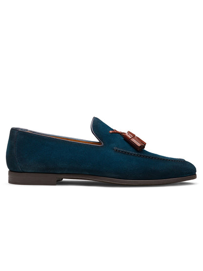 The Magnanni Dion in Navy Suede is a Spanish-made calfskin loafer with Línea Flex construction, a dark sole, and brown tassel detail, shown in side profile against a white background.