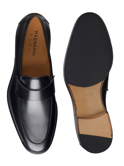The Magnanni Duerro in Black is a sleek black leather loafer, shown from top and sole views, featuring a smooth finish that elevates any luxury men's shoe collection.