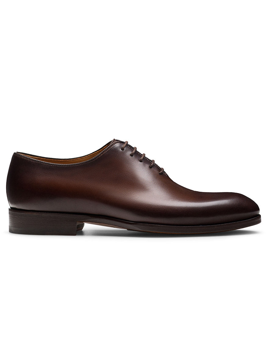 The Magnanni Fleur II in Tabaco is a handmade brown men’s Oxford dress shoe with closed lacing, shown in a side profile view on a white background.