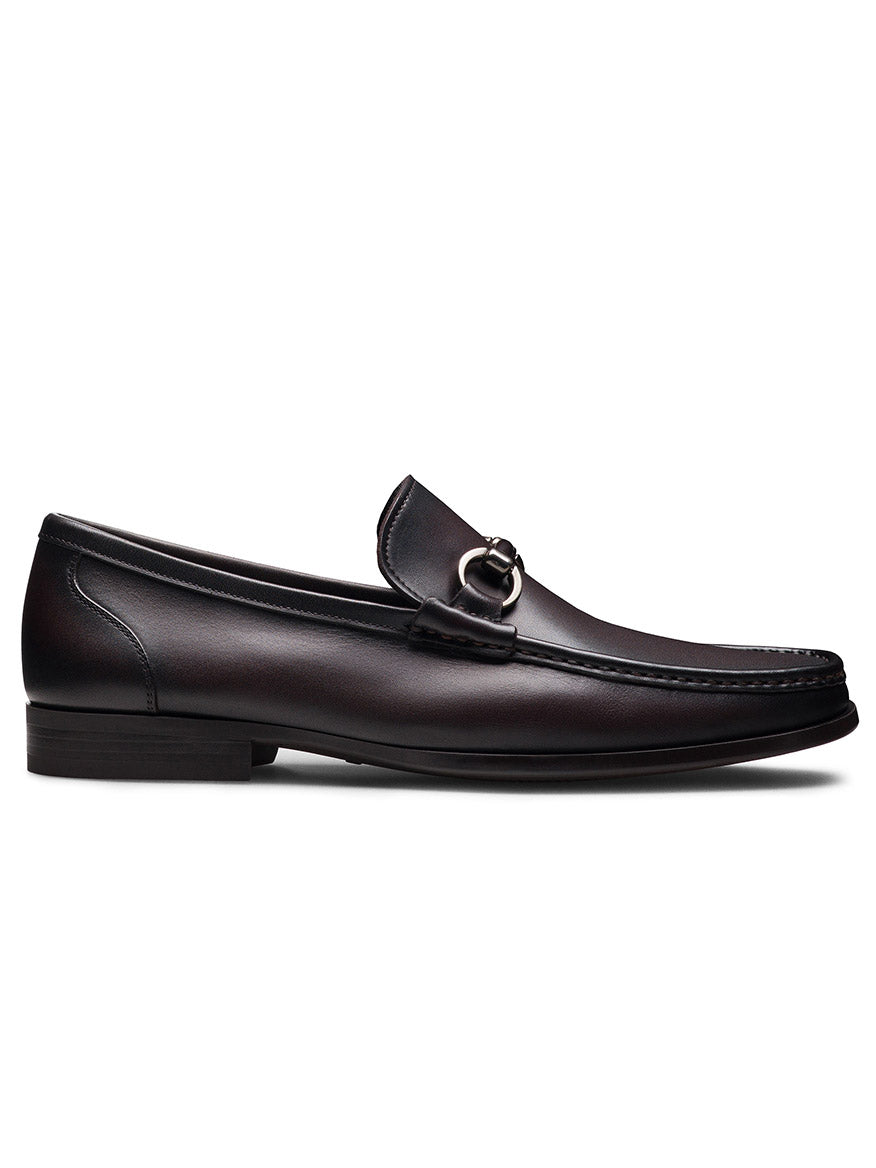 The Magnanni Gentry Soft Bit in Brown is a dark brown handcrafted moccasin leather loafer featuring a low heel and metal bit detail, displayed in a side profile view.