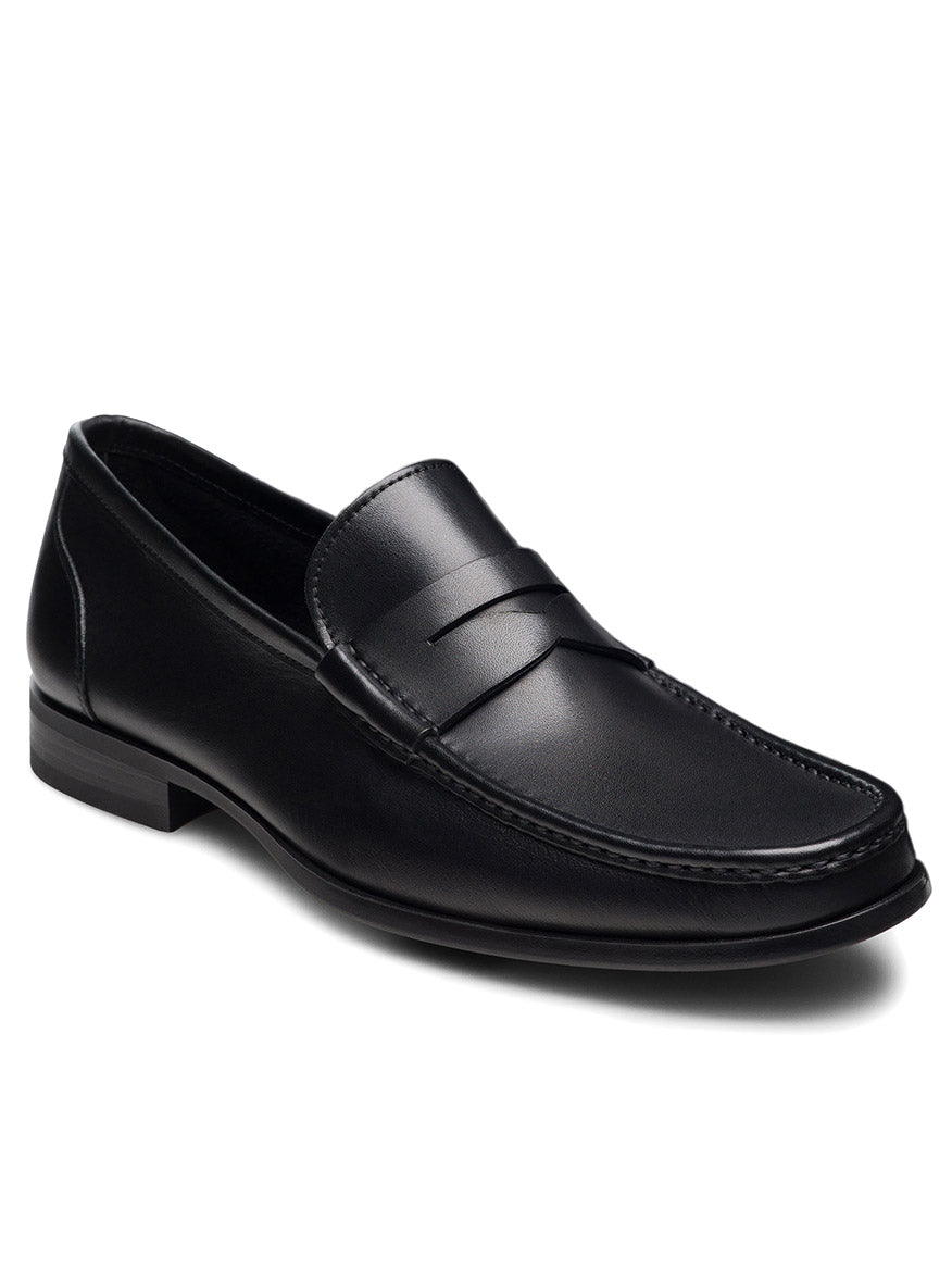 The Magnanni Gentry Soft Penny in Black is a black leather loafer with moccasin construction, a low heel, and stitched detailing, displayed on a white background.