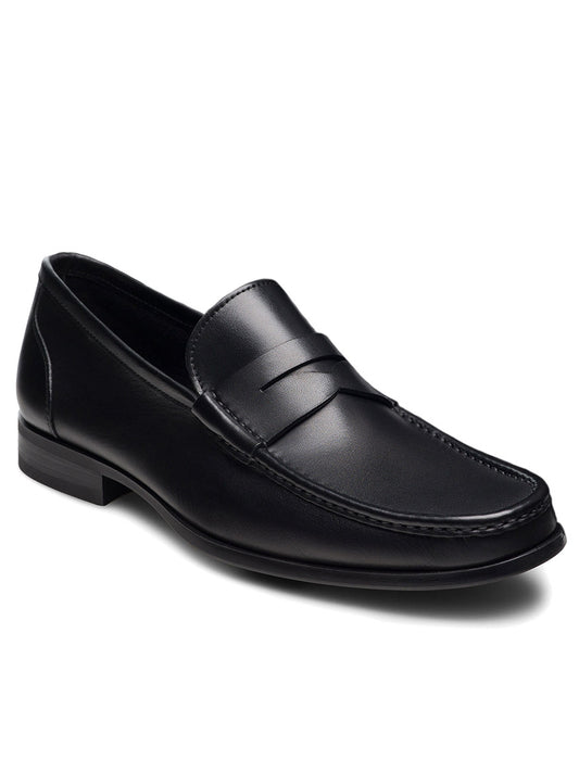 The Magnanni Gentry Soft Penny in Black is a black leather loafer with moccasin construction, a low heel, and stitched detailing, displayed on a white background.