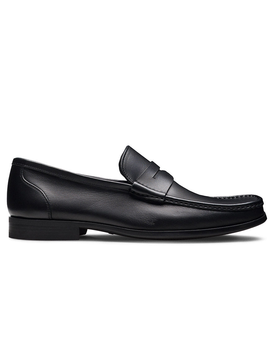 The Magnanni Gentry Soft Penny in Black, a leather penny loafer with moccasin construction, is displayed in side profile against a plain white background.