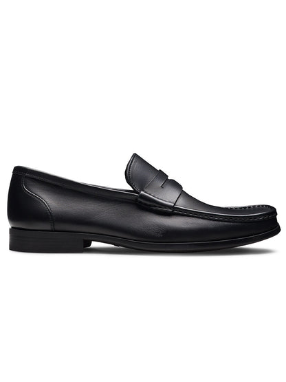 The Magnanni Gentry Soft Penny in Black, a leather penny loafer with moccasin construction, is displayed in side profile against a plain white background.