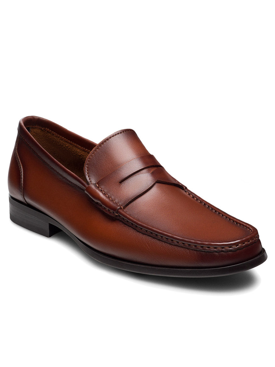 The Magnanni Gentry Soft Penny in Brandy is a brown leather loafer with moccasin construction, stitching detail, a low heel, and rounded toe, shown on a white background.
