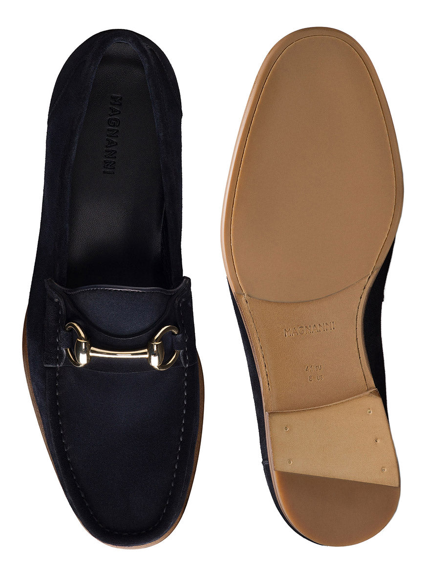 A pair of Magnanni Giancarlo navy suede loafers with gold metal detailing, made in Spain, shown from the top and bottom to highlight the design and sole.
