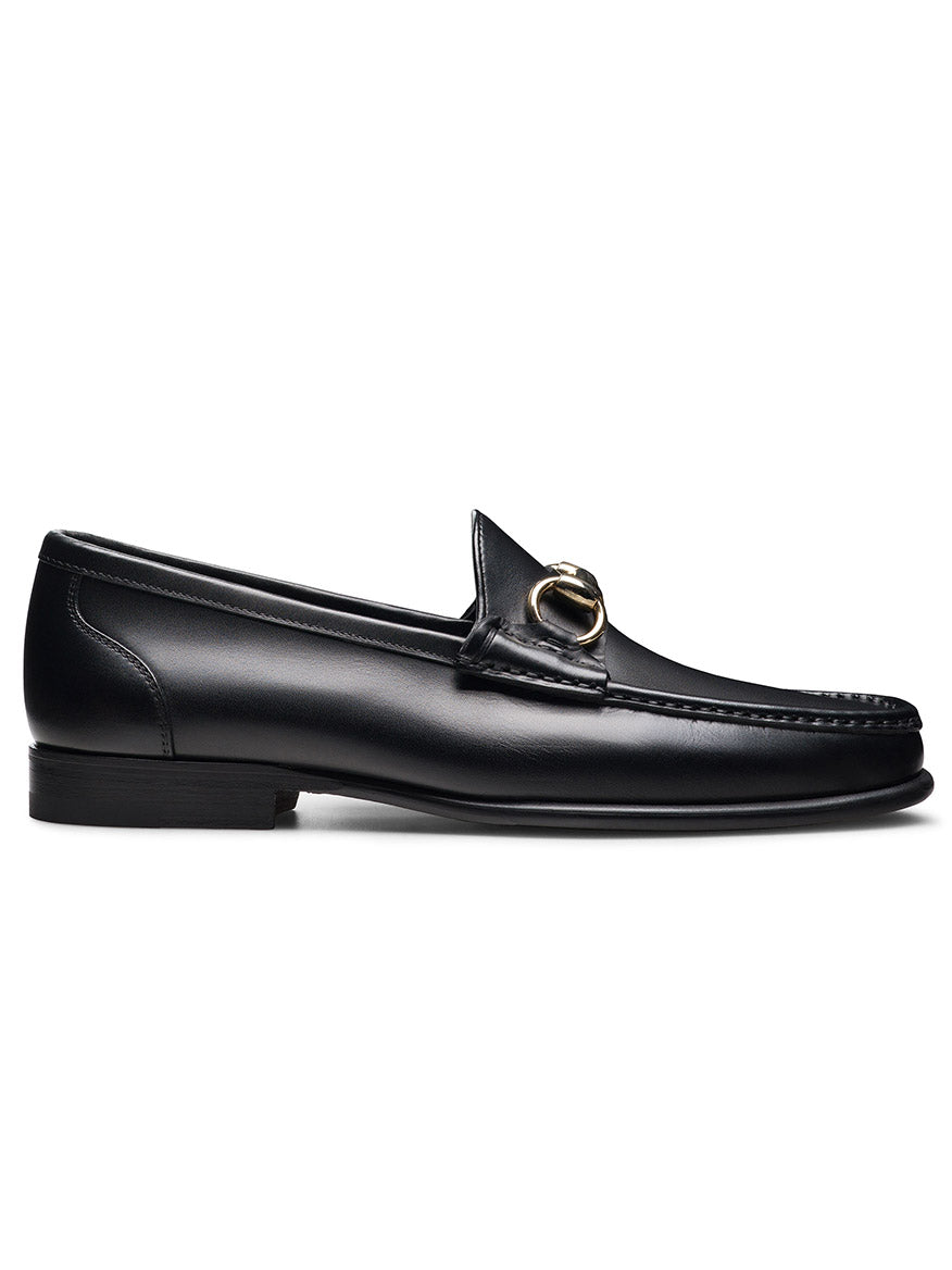 Magnanni Giancarlo in Black: black leather moccasin loafer with low heel and polished bit ornament on the upper, shown against a white background.