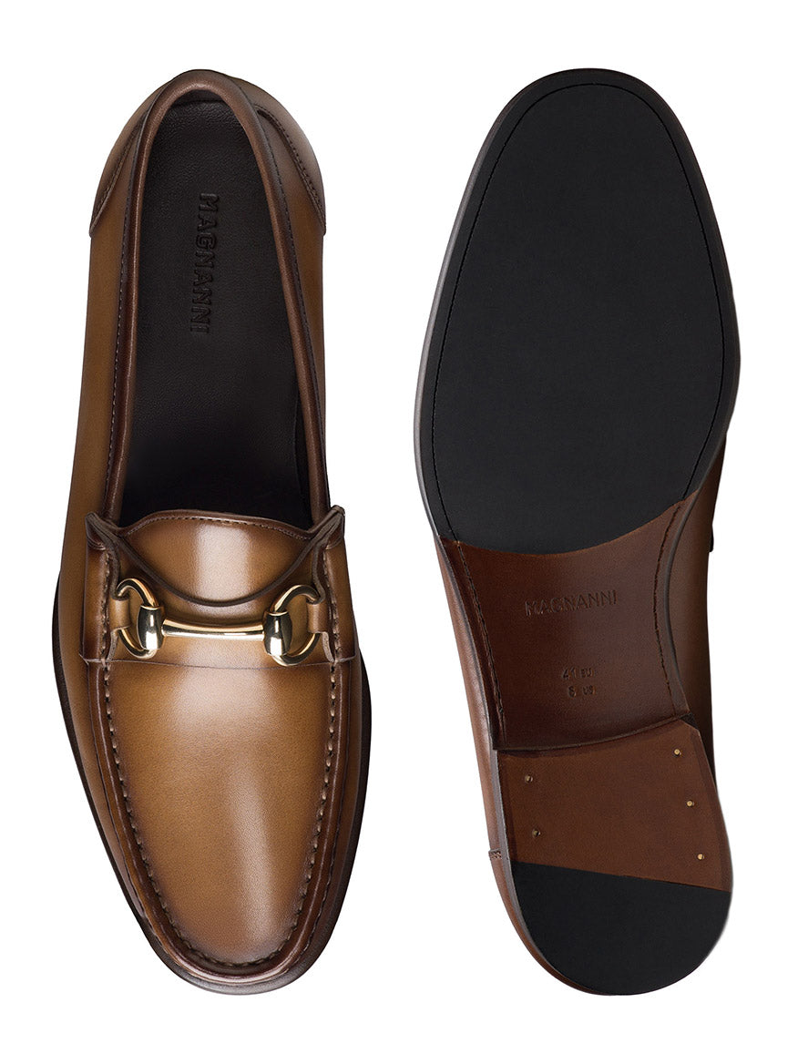 The Magnanni Giancarlo in Brown: brown leather moccasin loafers with a polished bit ornament, displayed from both the top and sole view.