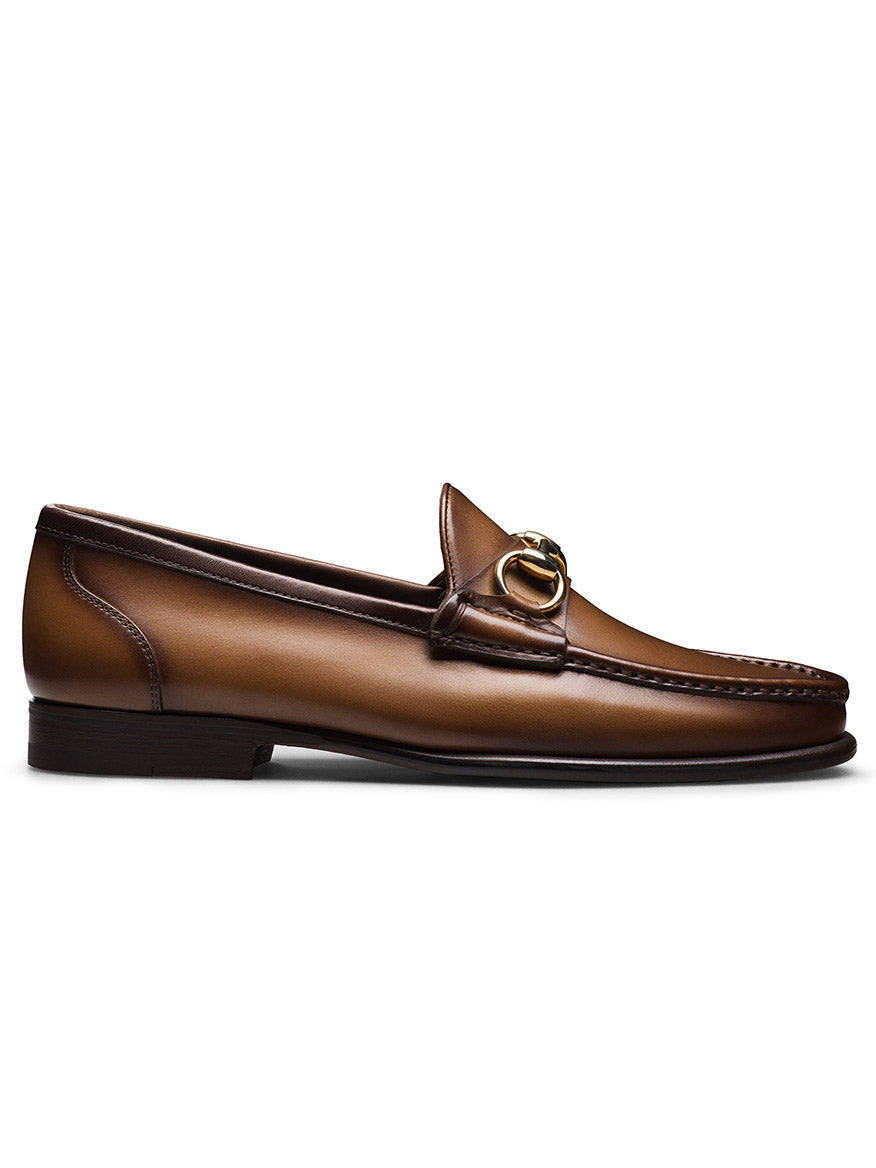 The Magnanni Giancarlo in Brown is a men's leather moccasin loafer with a gold buckle, shown from the side against a white background.