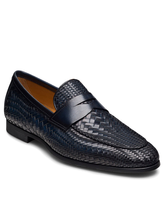 The Magnanni Halwell in Navy is a luxury men's penny loafer crafted from navy blue woven leather, featuring a classic penny slot detail, low heel, and black sole.