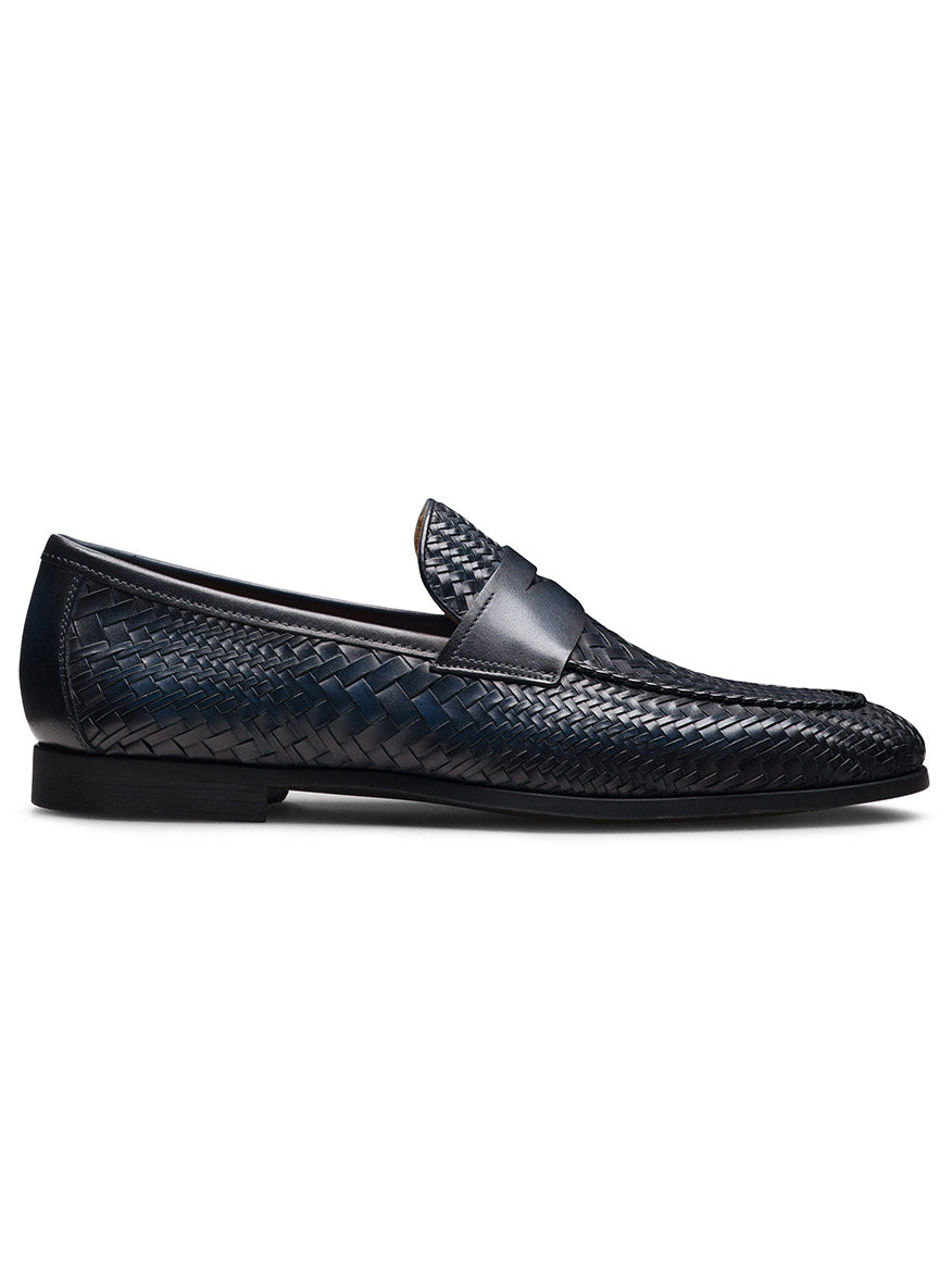 The Magnanni Halwell in Navy is a luxury loafer crafted from navy blue woven leather, featuring an almond toe, low heel, and smooth leather trim along the top edge.