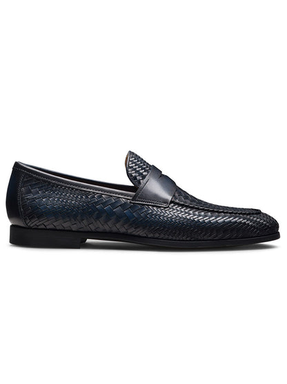 The Magnanni Halwell in Navy is a luxury loafer crafted from navy blue woven leather, featuring an almond toe, low heel, and smooth leather trim along the top edge.