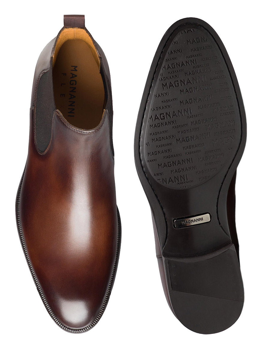 A modern pair of Magnanni Hanson Chelsea boots in brown with black soles.