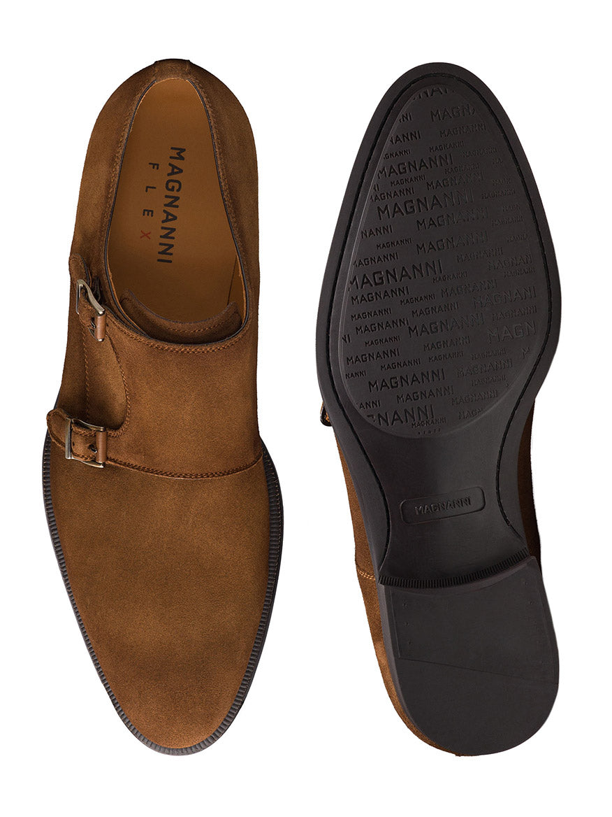 The Magnanni Harmon in Cognac Suede is a brown suede monk strap dress shoe with a single side buckle, cushioned footbed, and "MAGNANNI" branding on the insole and outsole—ideal for office wear. Shown from top and bottom views.