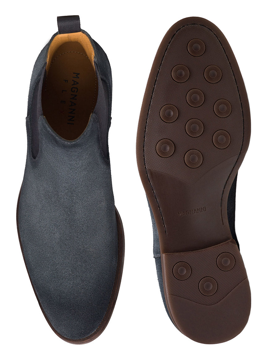 Pair of Magnanni Java dress shoes in Indigo Suede with a modern appeal, showcasing both the top view and the sole with circular treads. These dark-colored shoes feature a sleek design and cushioned rubber soles for added comfort.