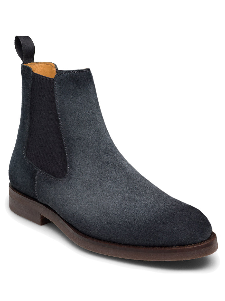 Introducing the Magnanni Java in Indigo Suede: a chic suede Chelsea boot in dark grey with black elastic side panels, a convenient pull-tab at the back, and a cushioned rubber sole for modern appeal.