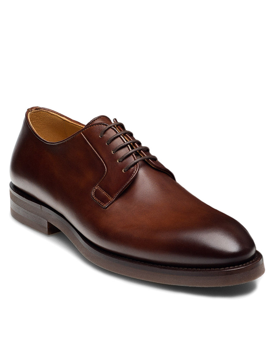 A single Magnanni Lanai dress shoe in Midbrown, featuring a closed lace-up design and a polished finish, is positioned against a plain white background, showcasing its cushioned footbed for added comfort.