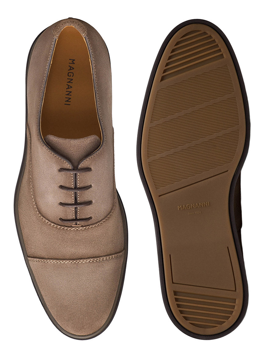 Top and bottom view of a pair of Magnanni Landis in Schore Suede, showcasing a smooth upper surface and cushioned rubber sole design.