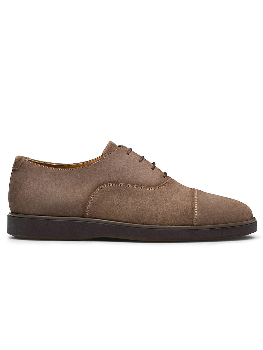 Side view of the Magnanni Landis in Schore Suede, a brown Oxford dress shoe featuring a cap toe and cushioned rubber sole, perfect for both style and comfort.