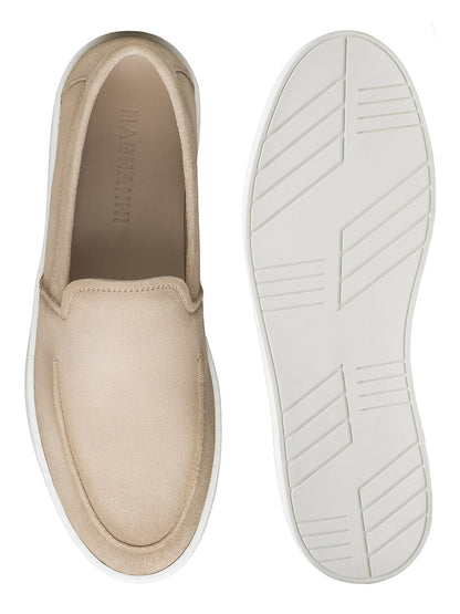 The Magnanni Lawford Venetian Flex in Tierra Suede features beige slip-on style and white rubber soles, shown from top and bottom views on a white background, highlighting Magnanni's signature comfort and style.
