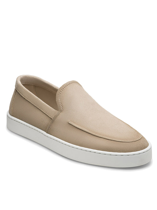 The Magnanni Lawford Venetian Flex in Tierra Suede features a beige suede slip-on design with a white rubber sole, displayed at an angle on a plain white background—an elevated take on men's dress shoes.