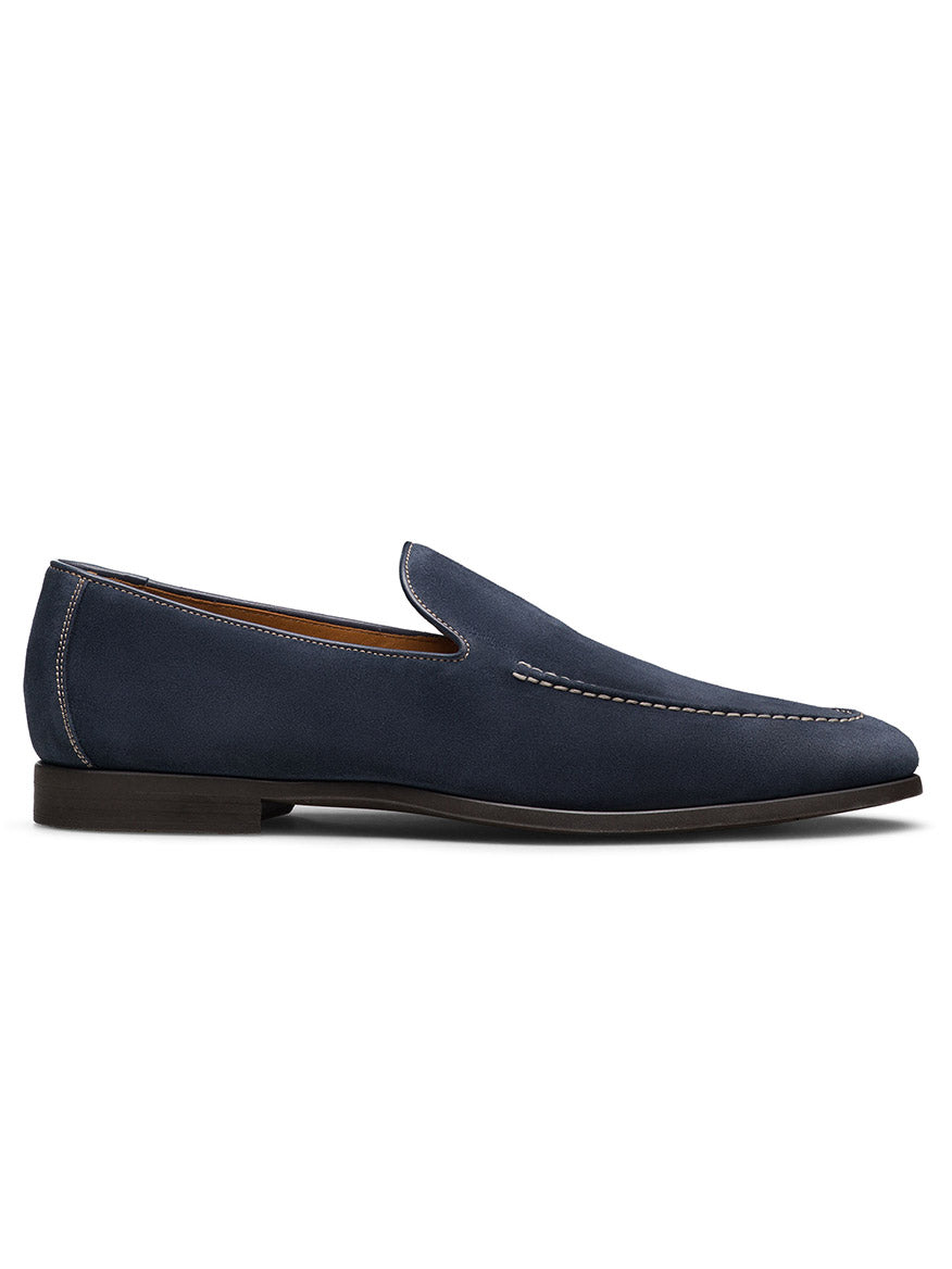 The Magnanni Lecera II in Navy Suede is a slip-on Venetian loafer with a suede leather upper, low heel, visible stitching, and is shown in side profile against a white background. Made in Spain.