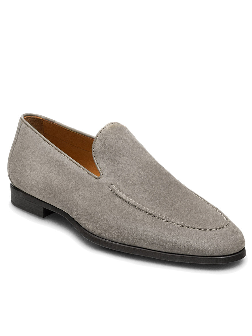 The Magnanni Lecera II in Tierra Suede is a gray suede Venetian loafer with a low black heel, visible stitching on the upper, and expert Spanish craftsmanship.