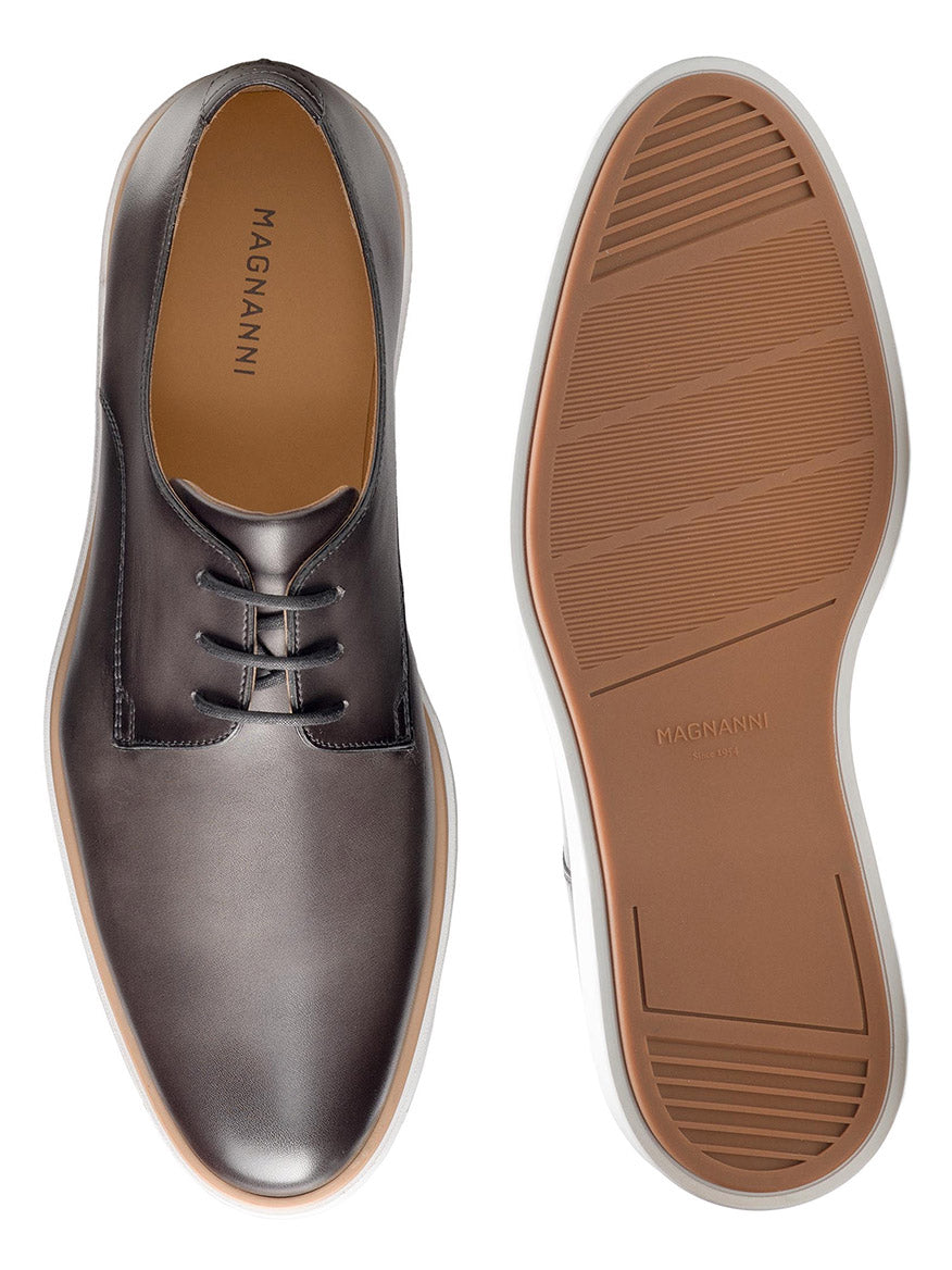 Top and sole views of the Magnanni Leone in Grey dress shoes, showcasing a sophisticated hybrid design with gray calfskin leather finish and cushioned white rubber soles.