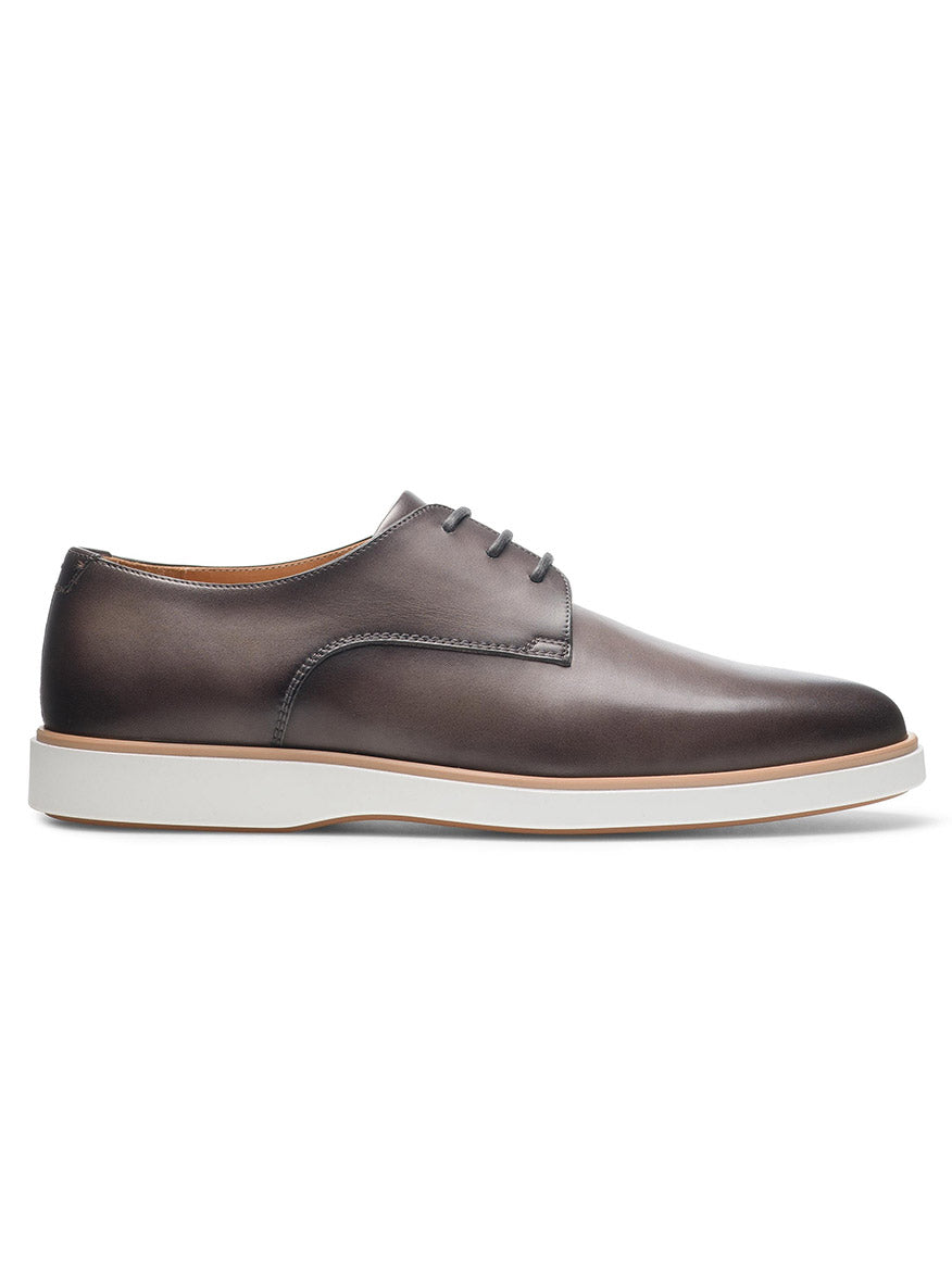 A side view of the Magnanni Leone in Grey, a dark brown calfskin leather lace-up shoe with a cushioned white rubber sole.