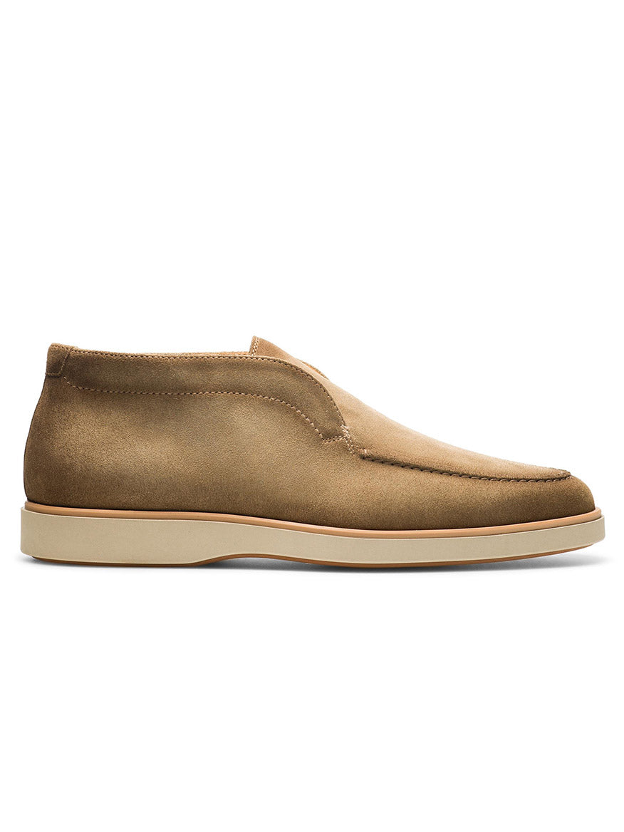 Presenting the Magnanni Loda in Taupe Suede: a sophisticated slip-on shoe crafted from tan suede, showcasing a minimalist design with a contrasting white rubber sole, and featuring a cushioned footbed for unparalleled comfort. Side profile view.