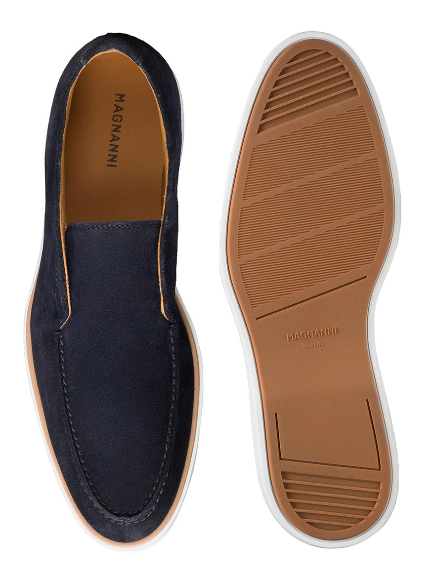 Navy blue Magnanni Loda in Navy Suede with a tan rubber sole, perfect for the daily commute. The shoe on the left shows the top view, while the one on the right reveals the sole. Designed for maximum comfort and style.