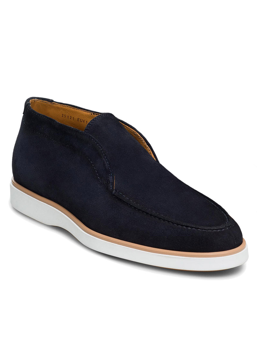 A Magnanni Loda in Navy Suede with a white sole and tan lining, viewed from a front-side angle, perfect for maximum comfort during your daily commute.