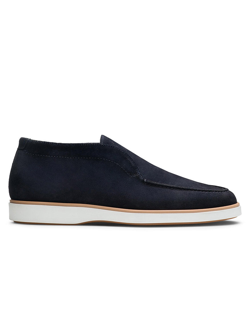 A single Magnanni Loda in Navy Suede with a white rubber sole, designed for maximum comfort during your daily commute, viewed from the side against a white background.