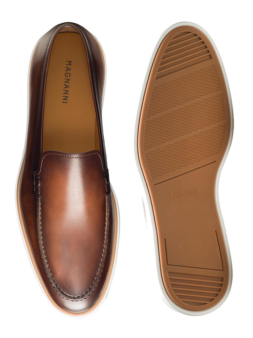 A pair of Magnanni Lourenco in Brown apron toe loafers on a white background.