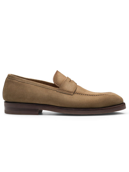 The Magnanni Lucien in Taupe Suede loafer showcased in a side view, boasts a low heel, moccasin toe stitching, and a minimalist design. This smart-casual loafer is crafted using Bologna construction for enhanced comfort and flexibility.