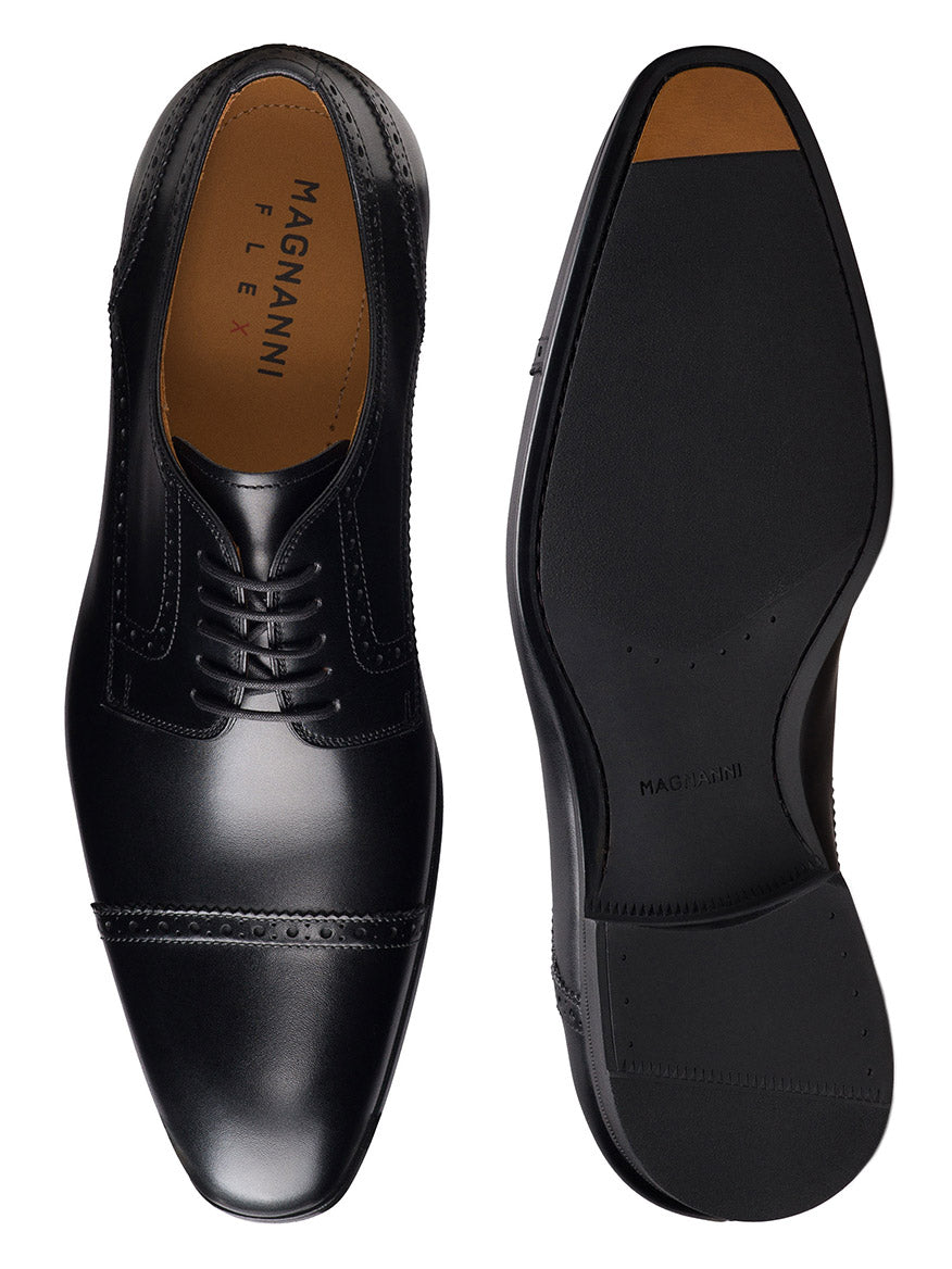 The Magnanni Macsen in Black is a pair of handcrafted leather oxford dress shoes with closed lacing and subtle stitching, shown from the top and bottom—ideal luxury footwear for any formal occasion.