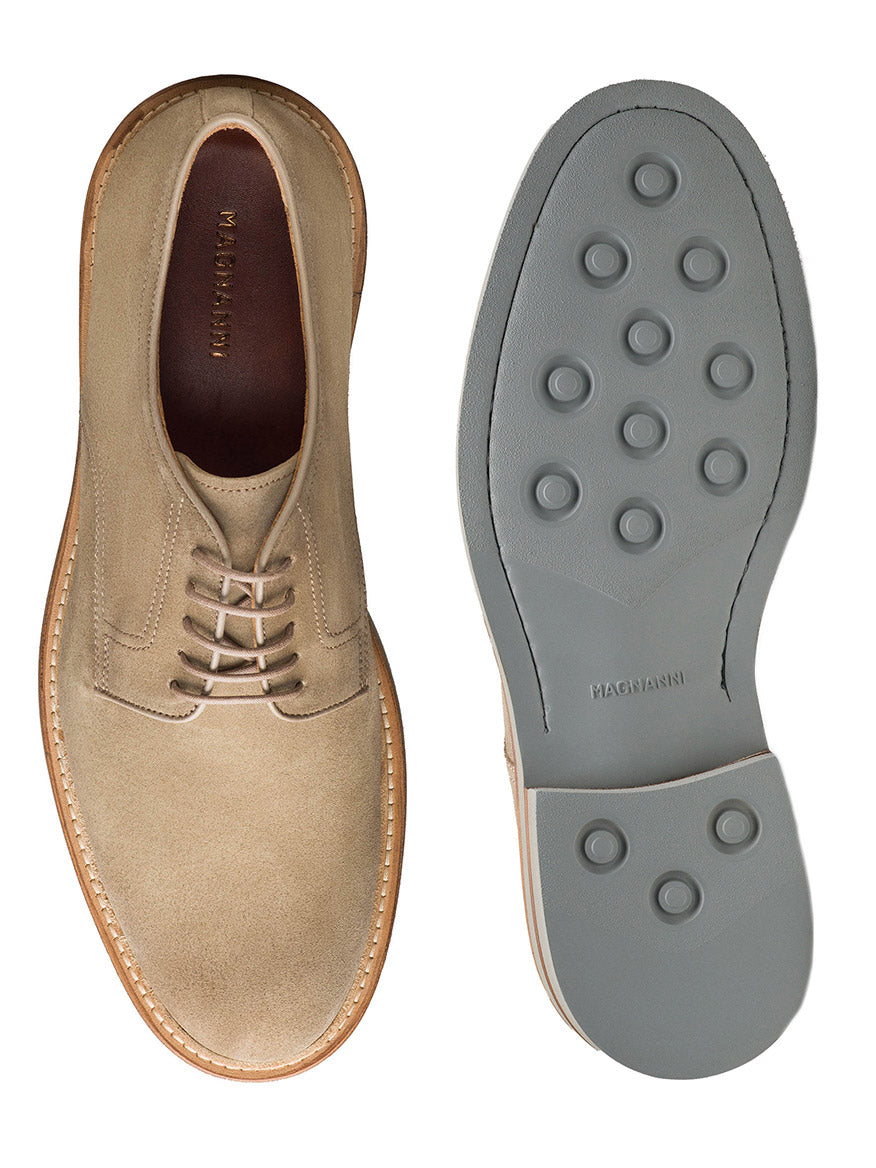 The Magnanni Marton in Taupe Suede features beige suede uppers and gray rubber soles with circular treads, shown from top and bottom angles—offering a stylish, smart-casual option for men.