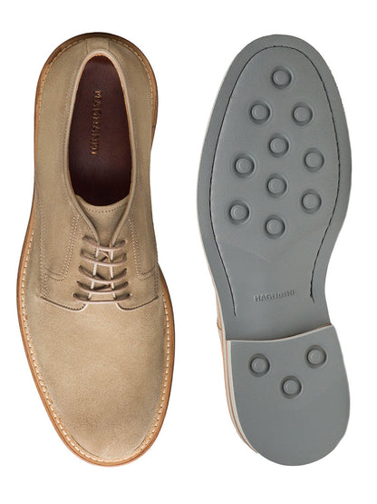 The Magnanni Marton in Taupe Suede features beige suede uppers and gray rubber soles with circular treads, shown from top and bottom angles—offering a stylish, smart-casual option for men.