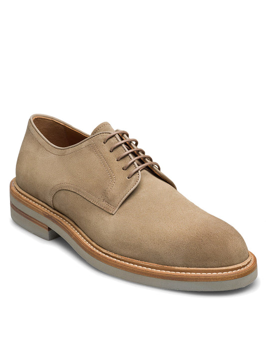 The Magnanni Marton in Taupe Suede is a men’s derby shoe with a round toe, brown laces, and a light-colored sole, ideal for smart-casual wear and shown on a white background.