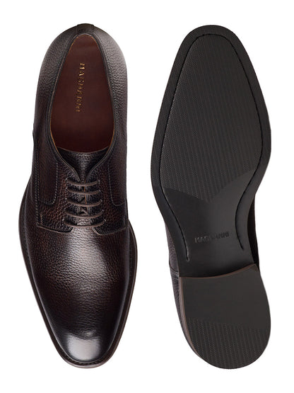 The Magnanni Melich V in Tumbled Brown is a pair of men's dark brown leather Derby shoes with classic laces, textured uppers, and smooth rubber soles—ideal smart-casual footwear for any occasion.
