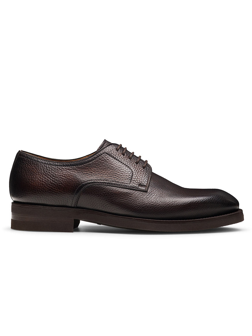 The Magnanni Melich V in Tumbled Brown features a textured brown leather upper, round toe, lace-up closure, and low stacked heel—ideal for smart-casual style with classic appeal. Displayed in a stylish side profile view.