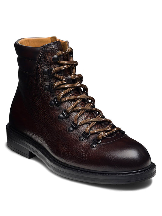 A Magnanni Montana X hiking boot in dark brown leather, featuring brown laces, black eyelets, and a black rubber sole, displayed against a white background.