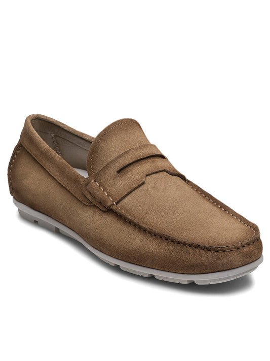 The Magnanni Monterey Keeper in Roccia Suede is a tan suede driving loafer with visible stitching, a low heel, and a textured rubber sole, handcrafted in fine leather and shown on a white background.