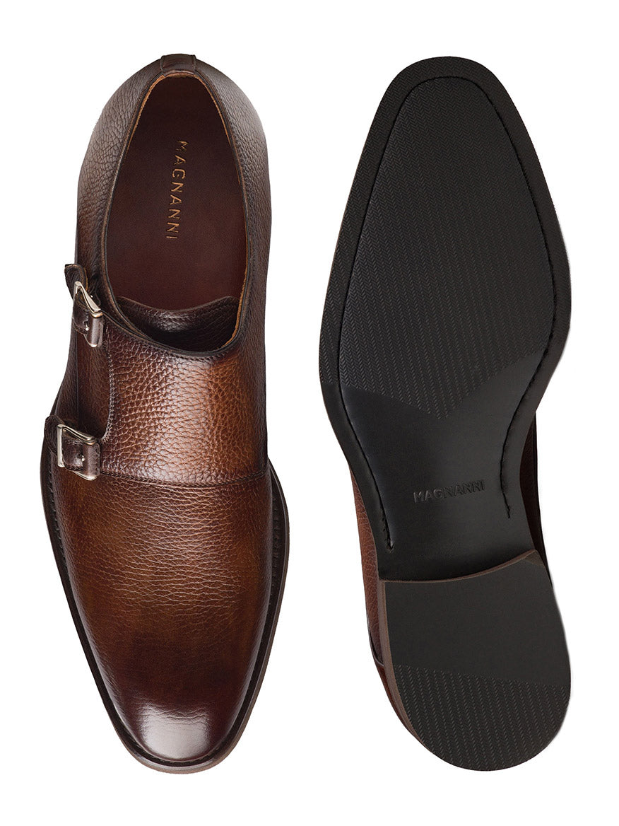 The Magnanni Omnia in Tumbled Tabaco are brown double monk strap shoes with a refined leather finish, shown from top and bottom views on a white background.