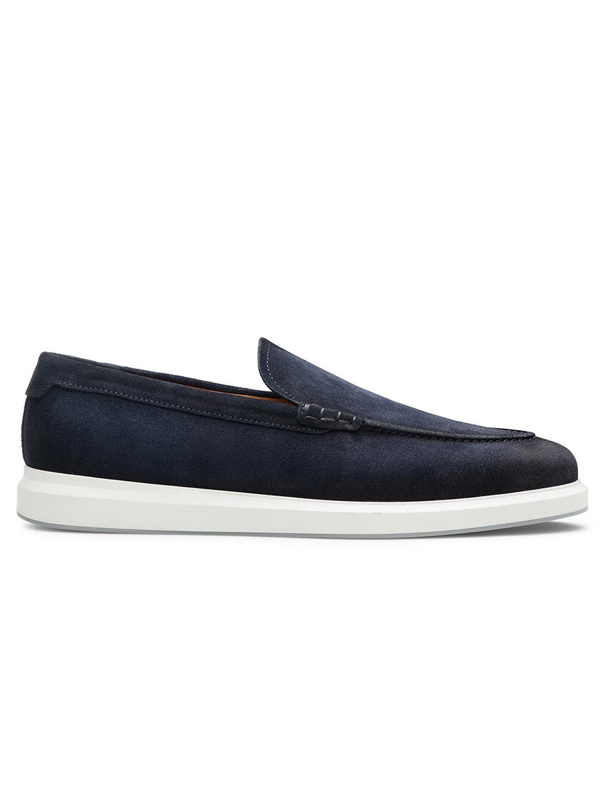 The Magnanni Orion in Navy Suede is a slip-on hybrid loafer with a white rubber sole, shown in side profile against a white background—ideal as a casual dress shoe.