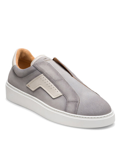 The Magnanni Phoenix Slip in Metal Suede & White is a modern cupsole sneaker featuring gray suede, a white rubber sole, discreet beige leather side accents, and a sleek slip-on design without visible laces.