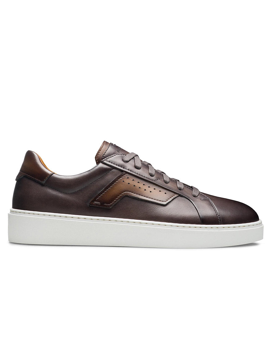 Brown leather Magnanni Phoenix sneaker with wing-inspired leather accents and a white sole, exuding a sophisticated sporty appeal.